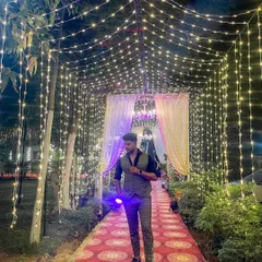 A personal photo of me at an event, enjoying the beautiful decor. The fairy light tunnel created a magical atmosphere.
