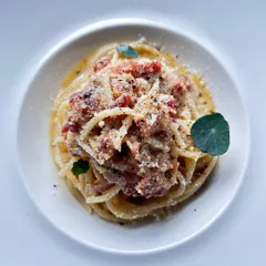 A classic Carbonara, perfectly executed with spaghetti, Pecorino Romano, and a generous amount of cracked Telicherry pepper. Simple, yet deeply satisfying.