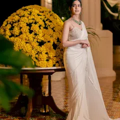 Modeling a beautiful white saree at the Radisson Blu, Goa. This shot captures the luxurious and serene ambiance of the resort, making it an aspirational destination for a beach wedding.