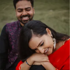 The sound of shared laughter is our favorite melody. This candid moment from Tulsi and Mohit's outdoor pre-wedding shoot shows the pure joy they find in each other's company.
