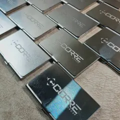 Duplicate of 57. A closer look at the engraved metal card holders, showing the clean and precise logo application.