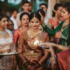 The bride's arrival is a moment of reverence and beauty. We captured this Mangalorean bride during her ceremony, with the warm glow of the aarti welcoming her.