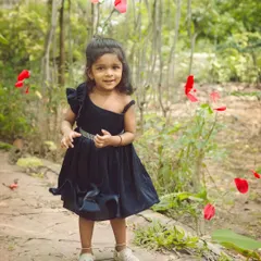 A magical moment with falling rose petals. We love adding a touch of fun and fantasy to our outdoor children's photoshoots.