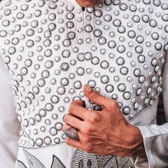 The pearl lotus motif, a symbol of power and purity, brought to life with intricate hand-embroidery on a modern Indian silhouette. This detail shot shows the fusion of traditional symbolism with contemporary couture techniques, a hallmark of my work.