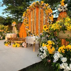 We love bringing vibrant traditions to life, like this joyful Haldi ceremony. The decor is rich with marigolds and sunflowers, creating a sun-kissed, energetic setting complete with traditional brass urlis for the rituals.