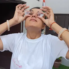 Performing eye cleansing exercises with special eye cups. This practice, called Netra Shuddhi, helps to soothe tired eyes and improve vision.