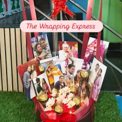 The basket of the anniversary bouquet, filled with the couple's photos, Ferrero Rocher chocolates, and fairy lights. It's a beautiful keepsake.