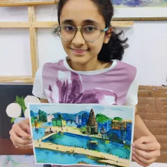 A lovely watercolor landscape of a riverside town, painted by one of our teen students. Our classes help students learn perspective and atmospheric effects.