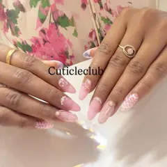 A soft and romantic design featuring a pink base with a delicate white lace pattern and 3D pearl and gold accents.