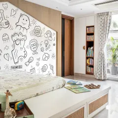 The room is designed to be bright and airy, with a dedicated reading nook and plenty of floor space for play. The design is minimal yet full of character and charm.