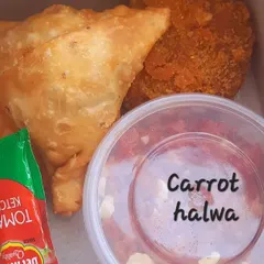 For those who love classic Indian flavors, I create snack boxes like this one for adults, featuring my crispy samosas, veg cutlets, and rich, homemade carrot halwa. It's a complete, satisfying treat.