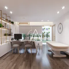 A doctor's cabin needs to be both a functional workspace and a tranquil consultation area. Here, we balanced a professional setup with direct visual access to an outdoor green wall, ensuring natural light and a sense of openness for both the doctor and the patient.