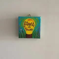 A bright idea for your wall. This 'Fitness is Power' mini canvas is for all the health enthusiasts out there. The vibrant lightbulb design is meant to be a fun and colorful reminder of your goals.