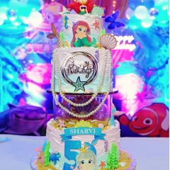 A mermaid party! The birthday girl wanted the tallest cake with as many mermaids as possible, and I was happy to oblige with this three-tier underwater creation.