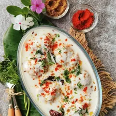 A classic comfort food, our Dahi Bhalla is a must-have for any celebration. Soft lentil fritters are soaked in creamy yogurt and topped with tangy chutneys and aromatic spices for the perfect bite.