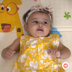 A precious moment with a baby girl wearing our sunny yellow floral jhabla. The front-button design makes it easy to dress even the wiggliest of babies.