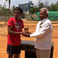Celebrating a well-deserved win at one of our corporate tennis tournaments. It's always a proud moment to see my students succeed in a competitive match.
