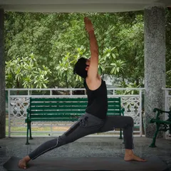 This is Virabhadrasana 1, another variation of the Warrior Pose. This asana is excellent for expanding the chest, reducing stiffness in the shoulders and back, and improving your ability to breathe deeply.