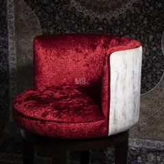 A detail of the Old Fashioned Bar Chair's seat. The rich, textured red velvet contrasts beautifully with the textured white back, balancing richness with refinement for a timeless and indulgent look.