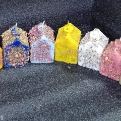 Nine days, nine colors, nine vibes. I've got a candle for each day of Navratri. These herb-dressed house-shaped candles match the color of the day.