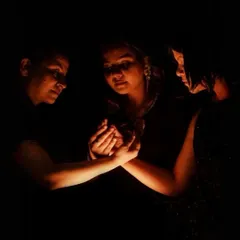 An intimate and powerful image from the 'Quest' photoshoot. This moment represents the support and shared strength among the characters in their journey of resilience.