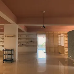 A view of our expansive studio floor before a class begins. The open layout provides flexibility for different workshops, events, and your own personal projects, ensuring you have the space you need to think and create freely.