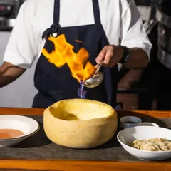 Get ready for a little drama at your table. I love finishing our famous Vodka Pasta in a wheel of Parmesan, flambéed right in front of you. It’s not just a dish, it’s an experience that brings the heat and flavor together.