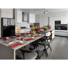 This modern, open kitchen is the heart of the home, designed for a family that loves to cook and gather. The large central island doubles as a dining space, with sleek Valcucine cabinetry and high-end appliances ensuring both beauty and top-tier functionality.