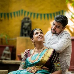 A tender moment between the couple in a traditional setting. We are often blessed to become family photographers, capturing milestones from the wedding to a child's naming ceremony.
