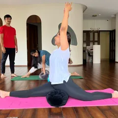 I believe props are helpers, not shortcuts. Here, a student uses a bolster to safely explore Hanumanasana (the splits), finding depth without strain. This is how we make every pose accessible to every body.
