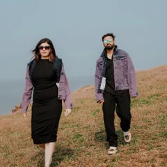 Capturing a cool, confident walk along a coastal hill. This shot has a candid, editorial feel, perfect for couples who want a stylish and modern pre-wedding album.