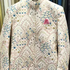 An open Jodhpuri jacket with beautiful, multi-colored architectural embroidery. This piece is available in four colors and can be customized to your measurements.