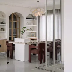 Welcome to Eden House, a 10,000-square-foot penthouse in Bengaluru designed to be a whimsical celebration of life. In this dining area, we played with form and light, creating a space that feels both grand and intimate, centered around a bespoke dining table that invites connection and conversation.
