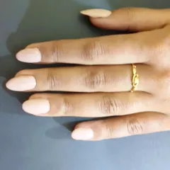 Another look at these perfect almond-shaped nails in a solid nude color. The shape elongates the fingers, and the high-gloss top coat gives them a durable, salon-quality shine.