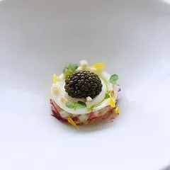 This is our take on modern Indian street food, a single bite of chaat presented with the finesse of gourmet cuisine. We use premium ingredients, including a touch of caviar, to elevate traditional flavors into a sophisticated canapé perfect for cocktail hours.