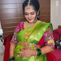A glowing look for Gowthami's baby shower. We used soft makeup to enhance her features, paired with a bright green saree and traditional jewellery, making her look and feel beautiful.