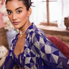This close-up captures a modern yet glamorous look with crystal embellishments under the eyes. It's a unique touch for a bride who wants a hint of sparkle, paired with flawless skin and a neutral lip for a balanced, chic finish.
