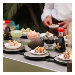 Our signature sushi conveyor belt is a highlight at any event. It offers a continuous, visually appealing display of freshly made sushi and maki rolls for guests to pick and choose from.