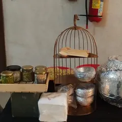 A chaat counter setup for a Ganesh Chaturthi celebration. The use of a birdcage as a decorative prop adds a whimsical and unique touch to the presentation.