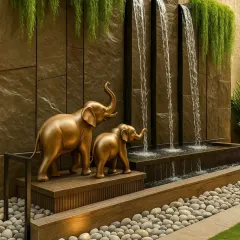 Another stunning water feature, this time with golden elephant sculptures. We design these custom features to add a unique and personal touch of elegance and tranquility to any landscape.