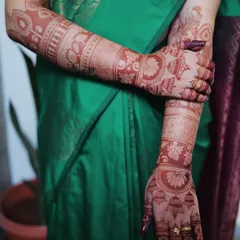 This is how a fresh henna stain looks right after the paste is removed. You can already see the beautiful orange color and the clarity of the intricate floral and geometric bands. Trust the process, as this stain will deepen into a gorgeous dark brown over the next 48 hours.