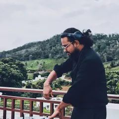 Finding my focus and rhythm while DJing outdoors. The natural backdrop adds a different kind of inspiration to the music.