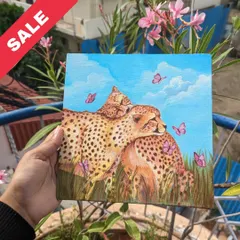 A tender moment between two cheetahs, surrounded by butterflies. This 8x8 inch acrylic painting captures a feeling of love and connection in the wild.