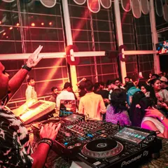 A view from my side of the booth, showing my professional Pioneer DJ setup. You can see me cueing up the next track while keeping the energy high with the current one.