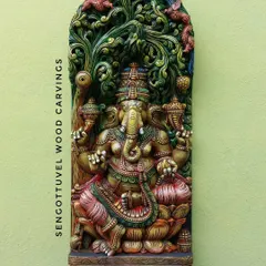 Our 36-inch multicolored Ganesha panel with Jali (latticework) is a vibrant masterpiece. Lord Ganesha is depicted under the Bodhi tree, and the hand-painted colors make every detail stand out.