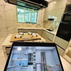 Another angle comparing the digital plan to the physical space. We ensure every element, including the placement of the chimney hood, oven tower, and island, is precisely executed according to the approved design.