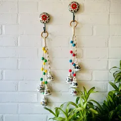 Meet our Symphony Chimes, a bestseller that has found a place in over 1100 homes and counting. Each chime is a little piece of music for your home, handcrafted with hand-painted ceramic bells, colorful wooden beads, and intricate macrame knots. They are perfect for adding a serene touch to your entrance or as a thoughtful Diwali gift.