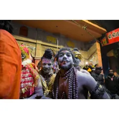 A candid portrait of a participant during a festival procession in the streets of Kashi. My goal is to get close and capture the raw emotion and character in people's faces, showing their faith without filters or posing.