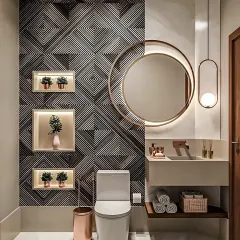 A powder room that makes a statement with a bold geometric-patterned accent wall. The backlit round mirror and rose gold fixtures add a touch of elegance and glamour.