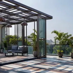 The play of light and shadow from the pergola adds a dynamic element to this Faridabad terrace throughout the day. The open-sided design maintains a sense of spaciousness while defining the lounge area.
